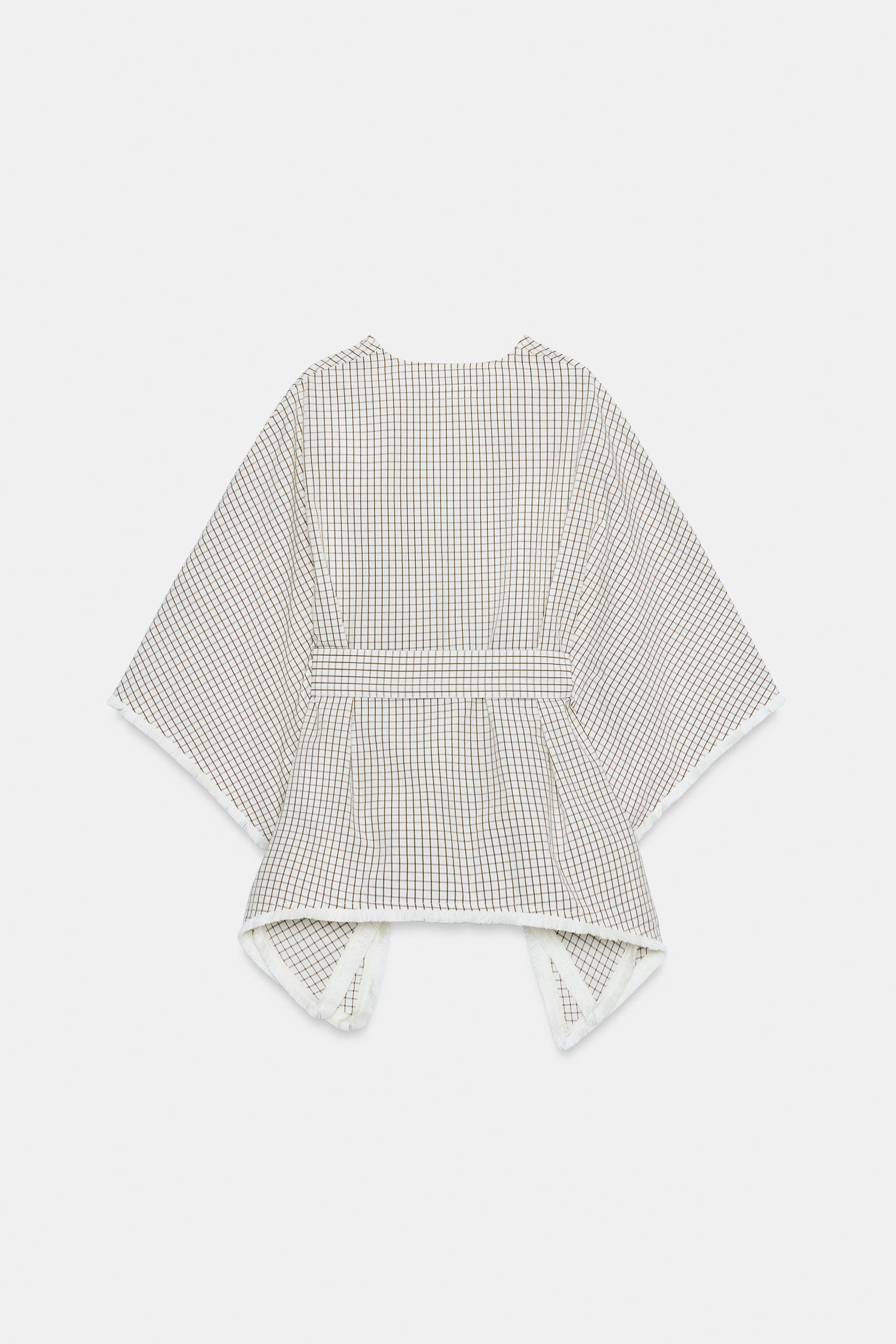 GILET EFFRANGÉ À CARREAUX
